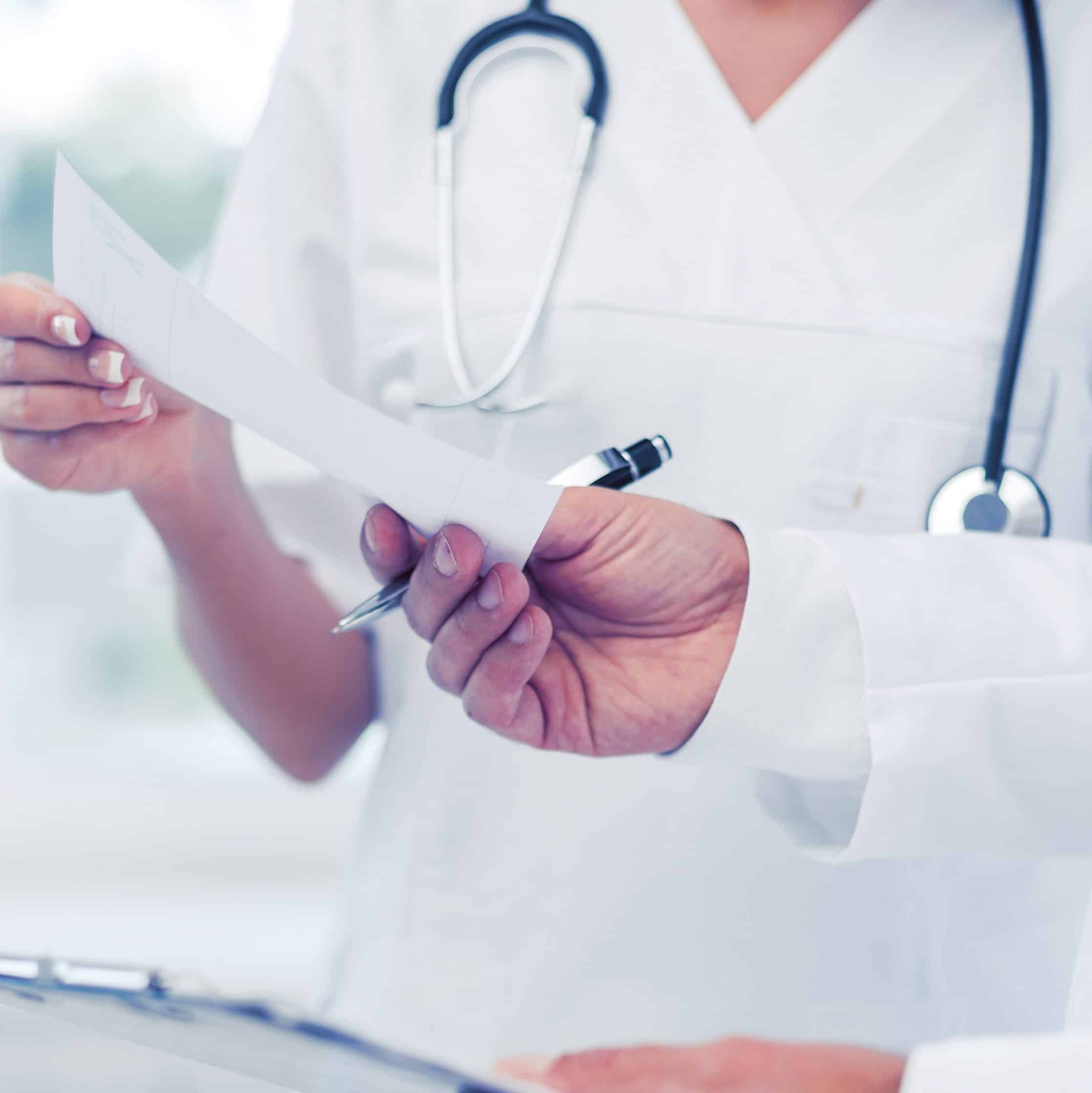 two doctors writing prescription