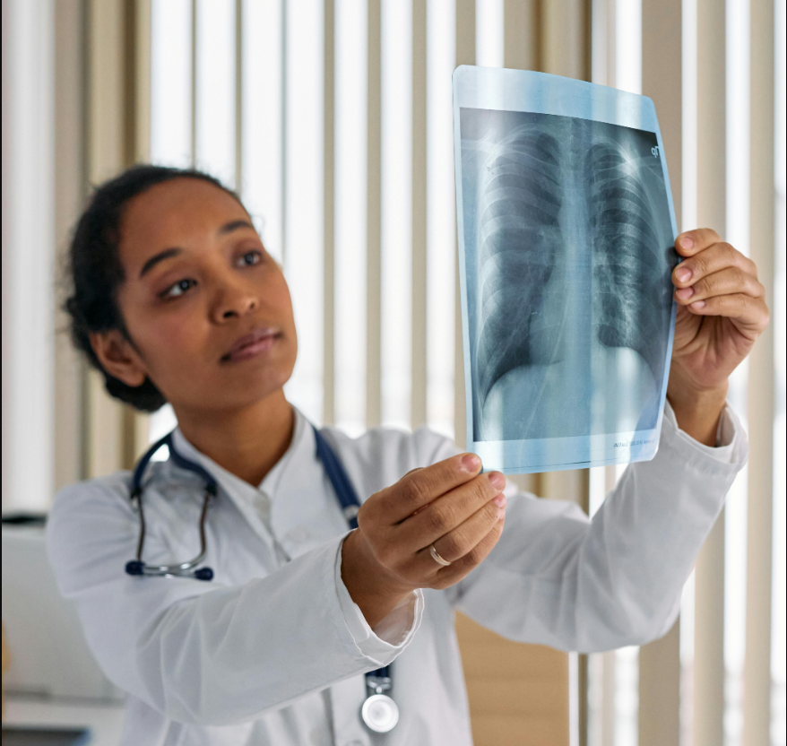 A medical doctor evaluating the results of an x-ray