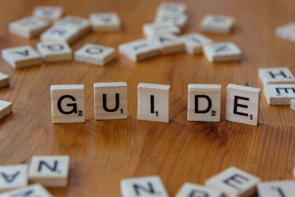 a set of blocks with the word "guide" being spelled out
