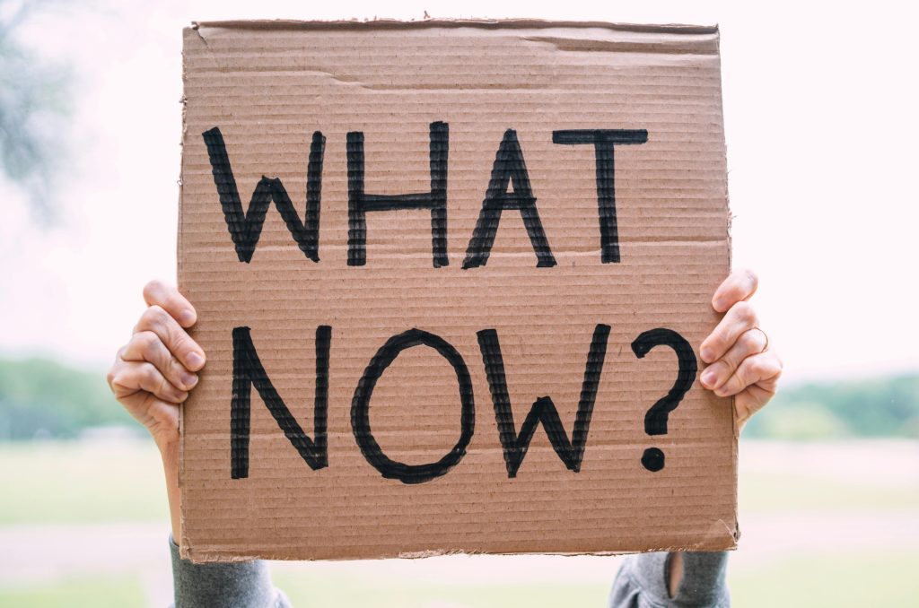 a signage asking "what now" to represent what to do if someone think he/she is exposed to asbestos